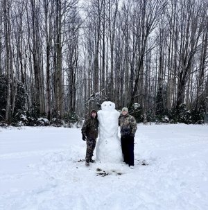 Finn and Zane Coulbourne in Milton made a snowman in memory of their dad.