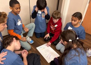 Love Creek students work together planning their school’s Inclusion Week. Clockwise from top right are Ben Kuns, Naomi Rodriguez, Zelie Zimmer, Zane Derti, educator Melissa Cooke, Chance Everson and Javier Ruiz.