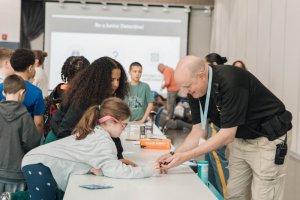 Working on fingerprinting are (l-r) Rowan Howard, Kenslea Lewis and Jeremy Gentis, with help from HOB Constable George Rath.