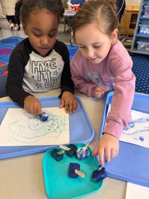 Zayvin Cannon and Rylee Goins put some thought into their ice painting.