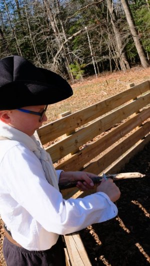 Legacy Academy third-grade student Caleb Petrella practices whittling wood.