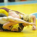 Rosser tries to turn the flexible Caruso to his back, but the official decides "too dangerous." BY DAVE FREDERICK