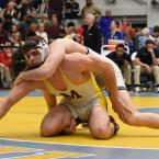 Milford's Kenny VanVordt tries to escape the grasp of Sallies' Joseph Miller in the 182-pound championship match. BY NICK ROTH