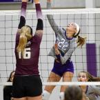 Royals junior Savannah Stewart, right, powers a kill past Salisbury Christian’s Hannah Robinson.