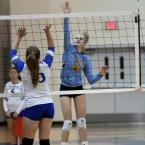 Cape freshman hitter Rileigh Wilson slams a kill shot past Dover’s Olivia Czepukaitis.
