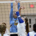 Cape sophomore Erin Morrissey blocks a Dover kill attempt.
