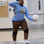 Senior Mackenzie Parker prepares to serve.