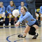 Senior Abby Bucklin bumps a service return in the fifth set.