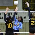 Cape senior Mikiyah Ennals pounds a spike through Padua’s Grace Palaypay, left, and Michelle Kozicki.