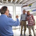 Photographer Tony Burns poses PAC president Peter Schott and Sen. Tom Carper for a photo.