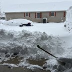 Robb Mapou of Rehoboth Beach has his priorities - shoveling space for his dog to go outside.