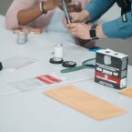 Detective Elizabeth Zambrano, H.O.B. school resource officer, prepares fingerprinting materials for the lesson.