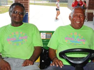 Kicking back in the green Gator and wearing neon Beach Blast shirts, Cape custodians Randy Sunkett, left, and Jay Kennedy are all about hospitality. BY DAVE FREDERICK