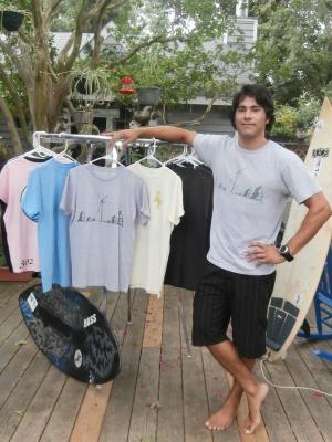 L Town owner and designer Corey Schab with a variety of the apparel he has available with his company. BY MOLLY MACMILLAN