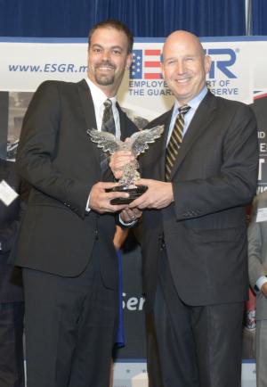 Small business Phoenix Restoration was the Delaware Warrior Friendly Award winner. Shown is Brian Potts, left, owner of Phoenix Restoration, with Gov. Jack Markell. SOURCE SUBMITTED