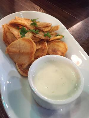 Homemade potato chips with blue cheese dipping sauce