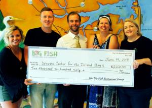 Attending the check presentation are (l-r) Big Fish Grill Rehoboth Manager Danielle Sobieski and server Robby Looney; Delaware Center for the Inland Bays Executive Director Chris Bason and Development Coordinator Mary Knight; and Jenny Burton, executive director for Big Fish Charitable Foundation. SUBMITTED PHOTO