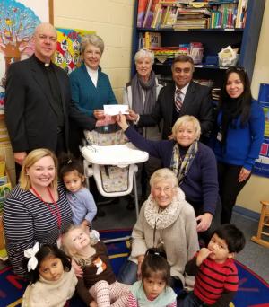 Check presentation attendees shown are in back (l-r) Pastor Paul Schmidt, Lutheran Church of Our Savior; Pam Cranston, English as a Second Language program vice president; Gail Dejmal, LCOS and Rotary member, and Harry K supporter; Harry Keswani, chairman and founder, Harry K Foundation; and Jesica Sepulveda, ESL program director. In front are Brittany Hoelle, nursery coordinator; Georgette Smith, LCOS member and ESL nursery volunteer; and Pat Campbell-White, LCOS elder, Rotary member and Harry K supporter. SUBMITTED PHOTO