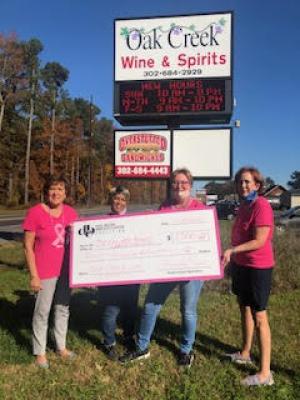 Check presentation attendees shown are (l-r) Lois Wilkinson, Delaware Breast Cancer Coalition program director of New Castle and Kent counties; Pamela Whitney, Oak Creek store manager; Kimberly Noon, Oak Creek product specialist; and Connie Holdridge, Delaware Breast Cancer Coalition program director of Sussex County. SUBMITTED PHOTO