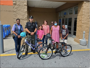 The contest was open to fourth-graders and hosted by School Resource Officer Rob Scisco, who named Sa’Rhian Ayers and Joanne Tsoukalas this year’s winners. Gathered for the prize giveaway at Walmart in Rehoboth are (l-r) Walmart Manager Tiffany Milligan, School Resource Officer Rob Scisco, Joanne Tsoukalas and her mother Karen Tsoukalas, and Sa’Rhian Ayers’ family members Ervin Oliver, Conswella Ayers and Azaky Ayers; Sa’Rhian was unavailable for the photo. SUBMITTED PHOTO