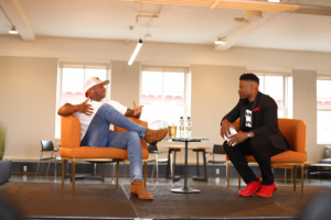 Millennial Summit speakers Jimmie Allen, left, and Blake "The Brain" Saunders talk during an in-person session at CSC Station in Wilmington. SUBMITTED PHOTOS
