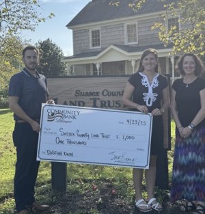 Sussex County Land Trust check presentation attendees shown are (l-r) Tyler Stetz, Community Reinvestment Act officer for Community Bank Delaware; Sara Bluhm, SCLT executive director; and Jessica Johnson, Community Bank Delaware Rehoboth branch manager. SUBMITTED PHOTO