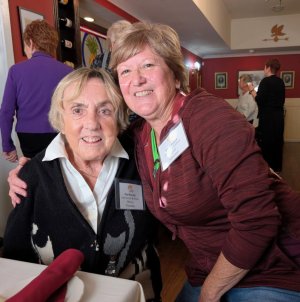 Pat Riordan, who co-founded Just Us Cat and Kitten Rescue with Kathy Askew, gets a hug from Eileen Pollack during the event at 1776 Steakhouse. SUBMITTED PHOTOS