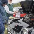 Dennis Morrison shows off photos of his 1960 Triumph's restoration.