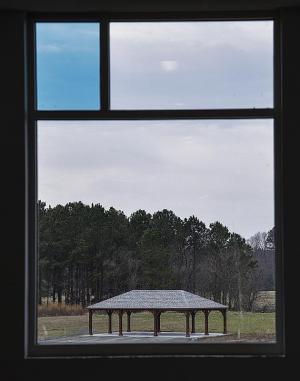 The school’s many windows allow expansive views of the property. Several window panes feature the signature Cape blue color.